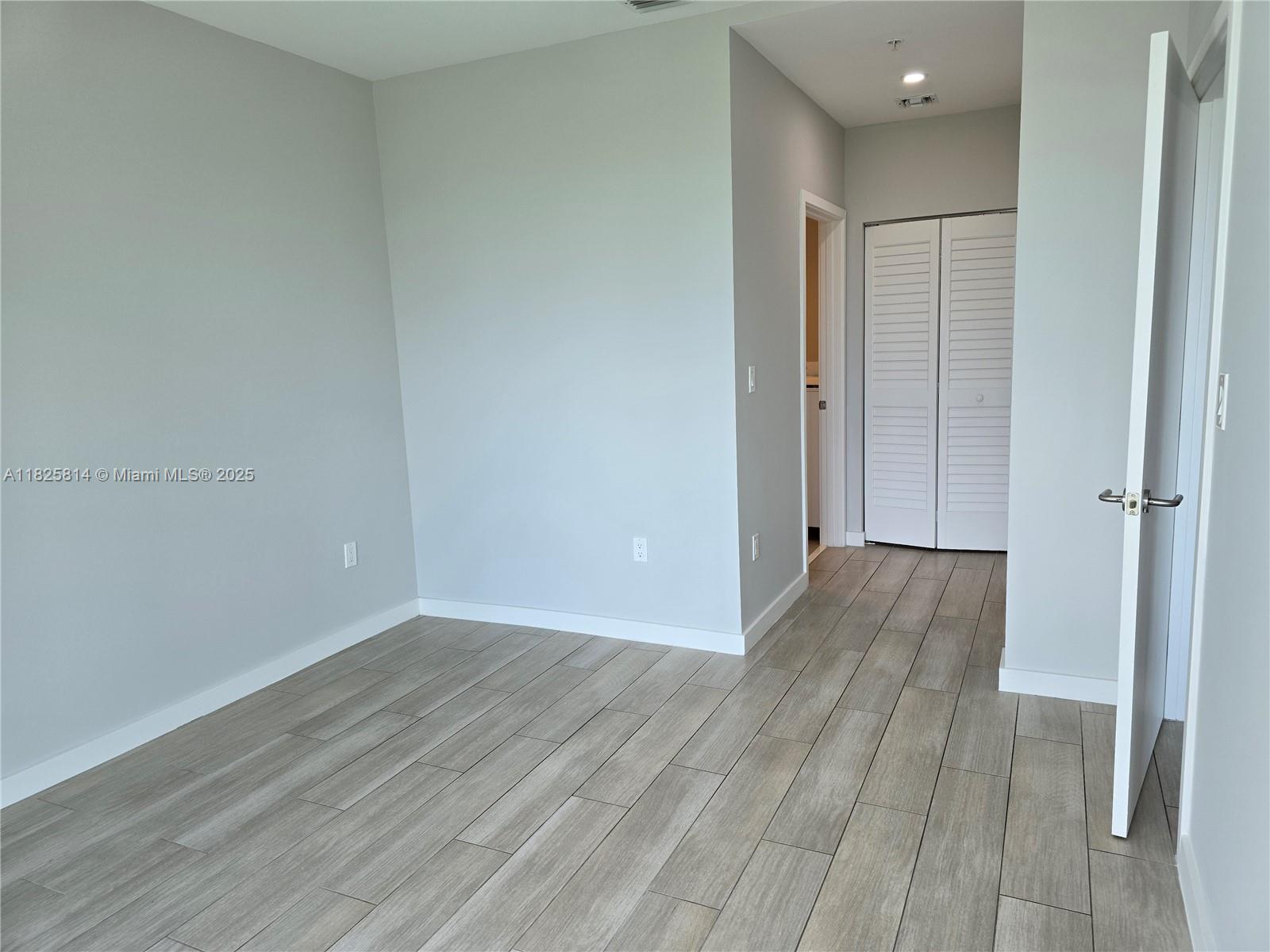 1600 Southwest 1st Avenue, Unit 809 Miami, FL 33129 - Photo 6 of 24 wooden floor in an empty room