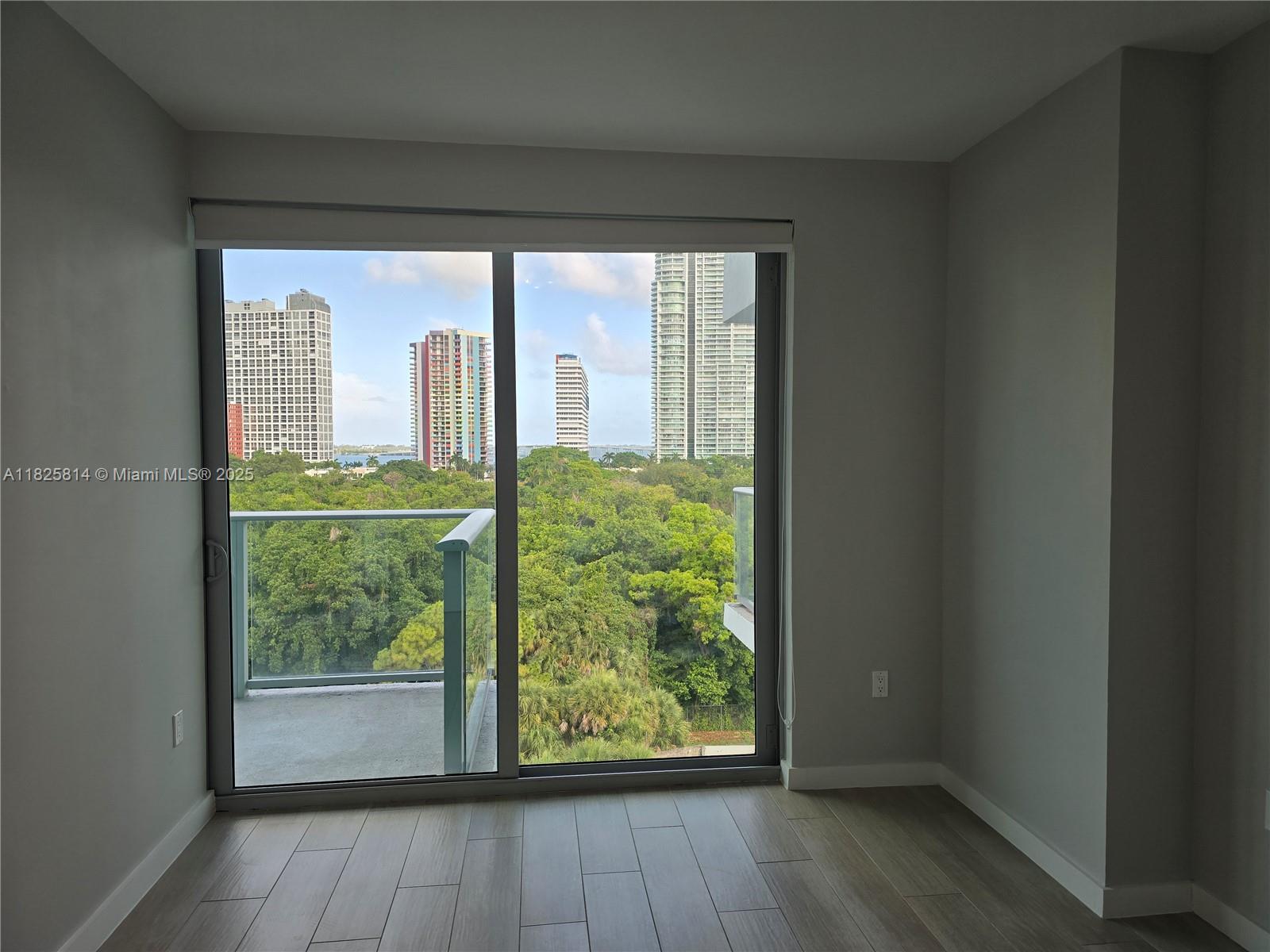 1600 Southwest 1st Avenue, Unit 809 Miami, FL 33129 - Photo 7 of 24 a view of hallway with a large window