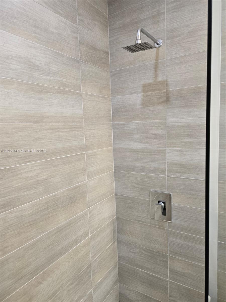 1600 Southwest 1st Avenue, Unit 809 Miami, FL 33129 - Photo 10 of 24 a bathroom with a shower