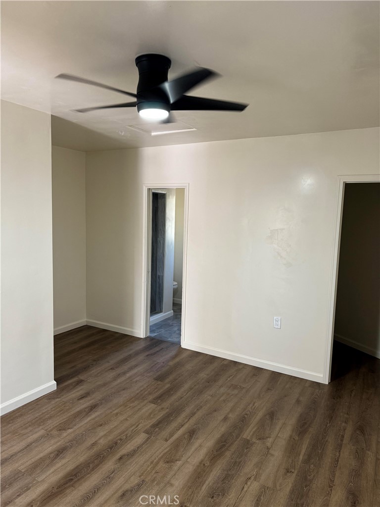 4764 Indian Hill Road Riverside, CA 92501 - Photo 6 of 8 a view of an empty room with wooden floor and closet