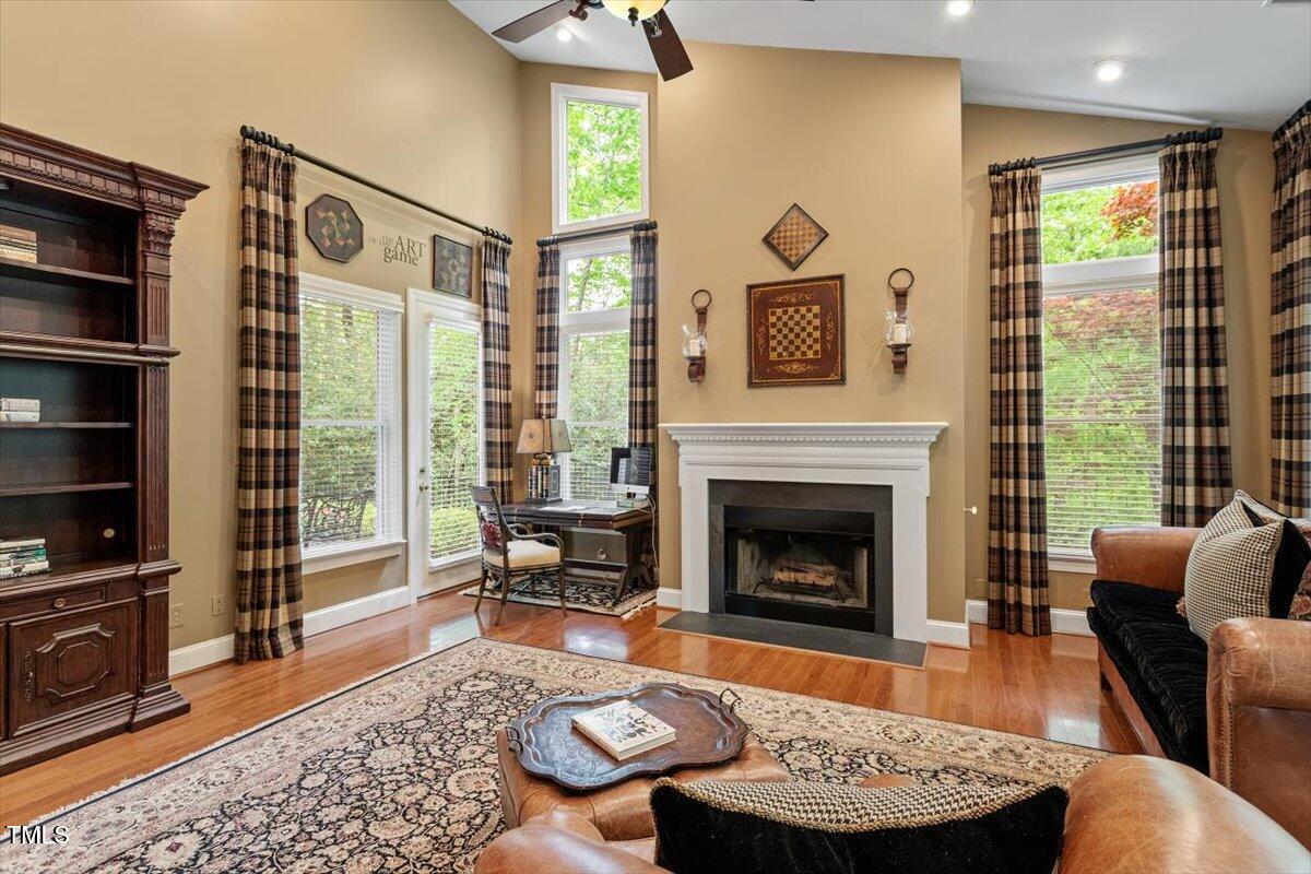 919 Woodham Pittsboro, NC 27312 - Photo 13 of 43 a living room with furniture and a fireplace