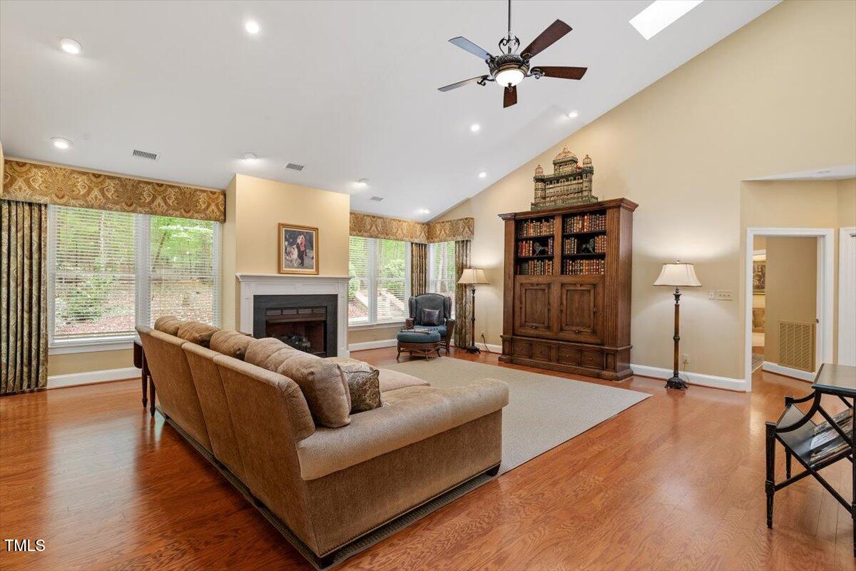919 Woodham Pittsboro, NC 27312 - Photo 21 of 43 a living room with furniture ceiling fan and a fireplace
