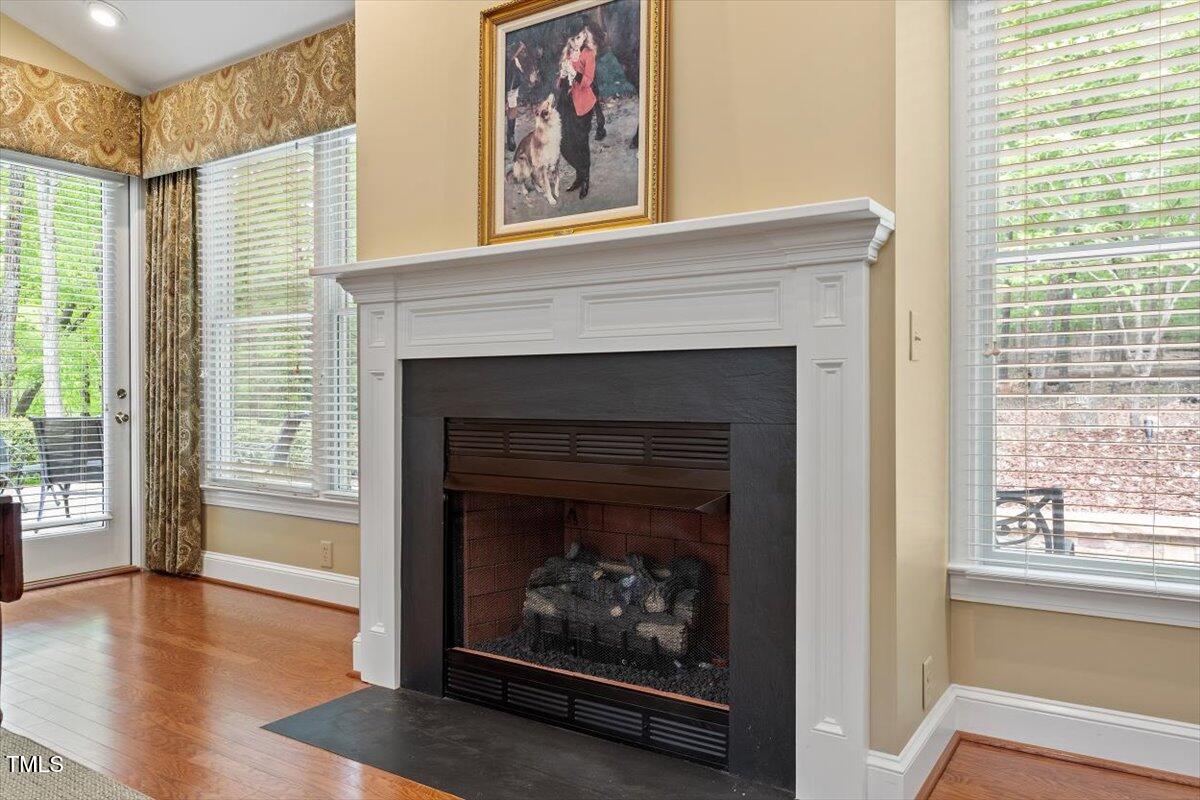 919 Woodham Pittsboro, NC 27312 - Photo 22 of 43 a living room with a fireplace with wooden floor