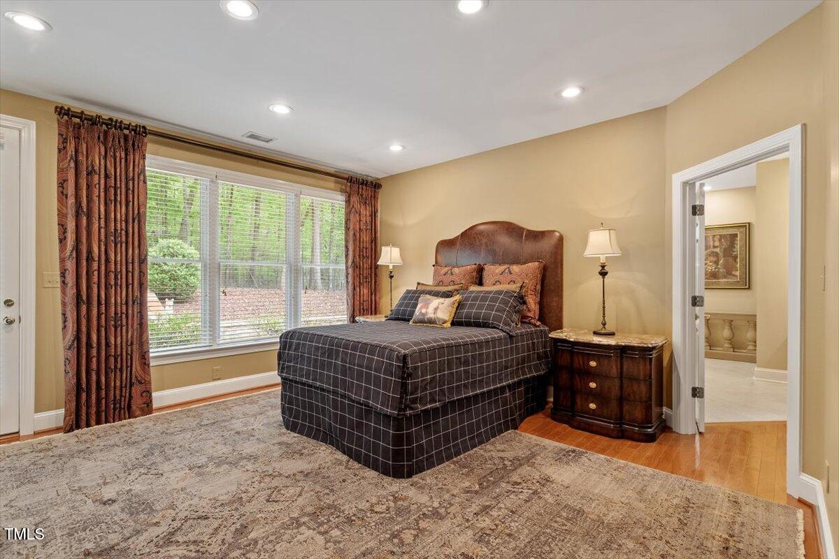 919 Woodham Pittsboro, NC 27312 - Photo 25 of 43 a spacious bedroom with a bed and window