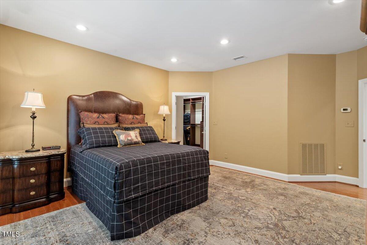 919 Woodham Pittsboro, NC 27312 - Photo 26 of 43 a bedroom with a bed and cabinets
