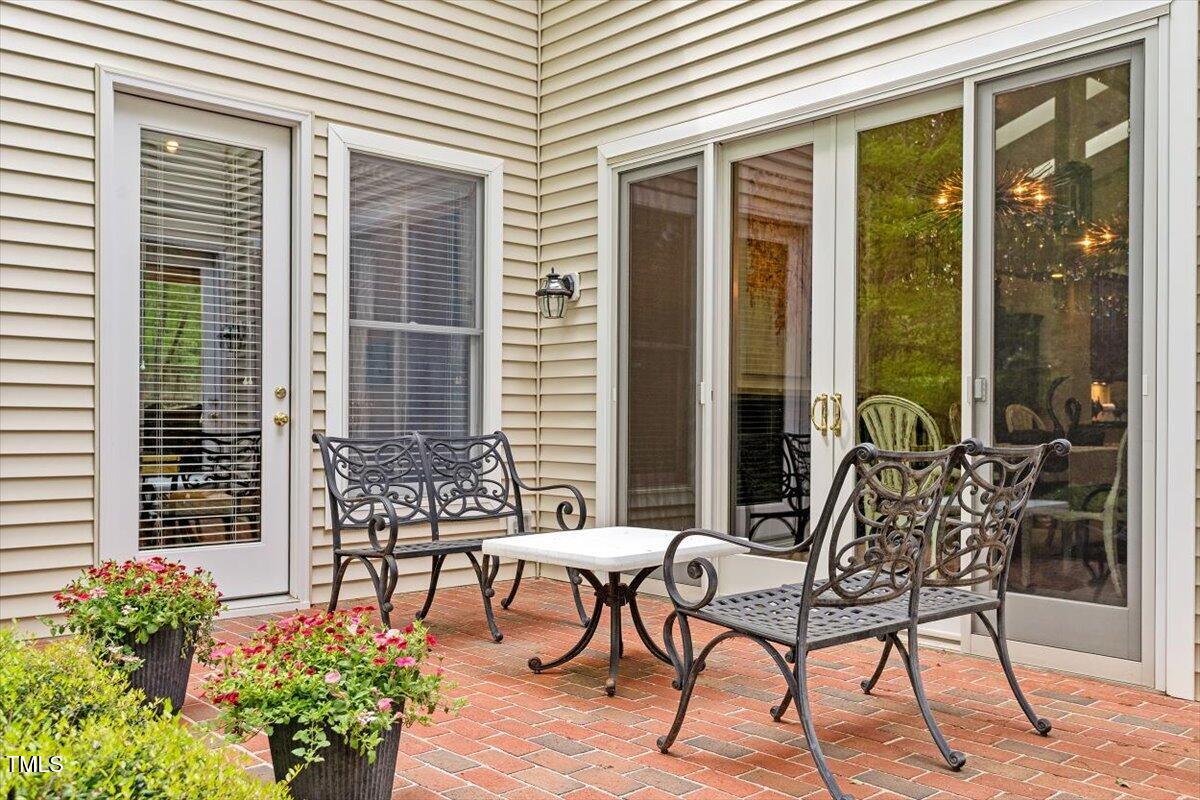 919 Woodham Pittsboro, NC 27312 - Photo 35 of 43 a view of balcony with chairs and potted plant