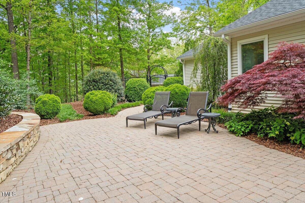 919 Woodham Pittsboro, NC 27312 - Photo 39 of 43 a view of a backyard with sitting area and furniture