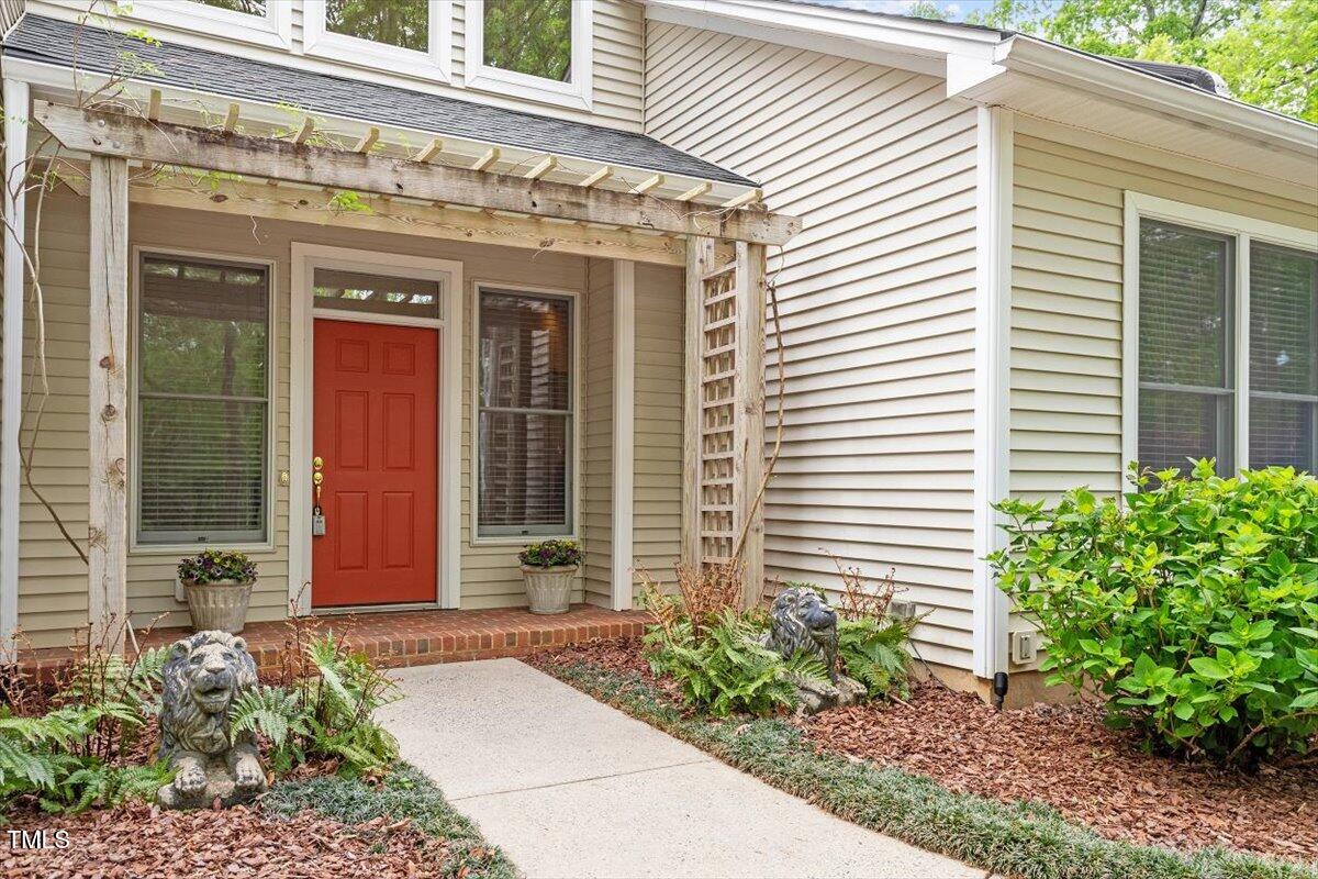 919 Woodham Pittsboro, NC 27312 - Photo 3 of 43 a front view of a building with potted plants