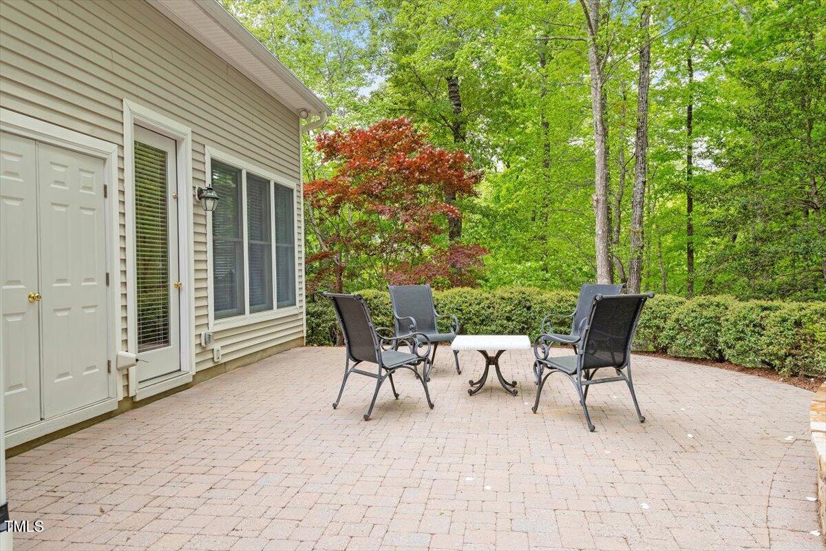 919 Woodham Pittsboro, NC 27312 - Photo 41 of 43 a patio with yard table and chairs