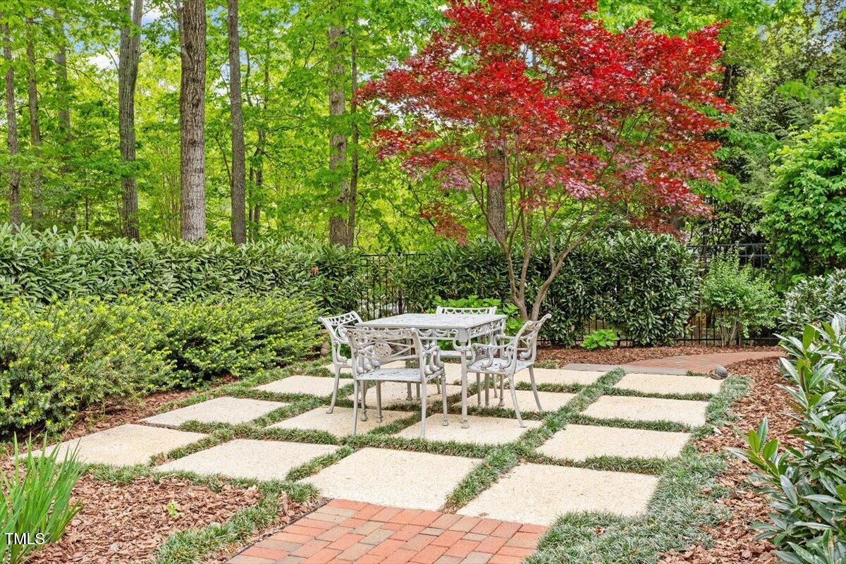 919 Woodham Pittsboro, NC 27312 - Photo 5 of 43 a view of a patio with table and chairs and potted plants