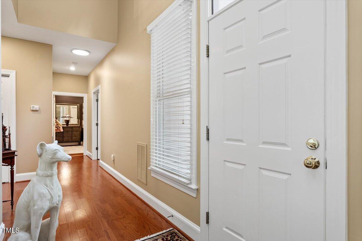 919 Woodham Pittsboro, NC 27312 - Photo 6 of 43 a view of a hallway with wooden floor