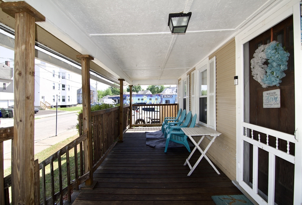 16 Amity Court Springfield, MA 01108 - Photo 3 of 42 a view of a porch with furniture and a window