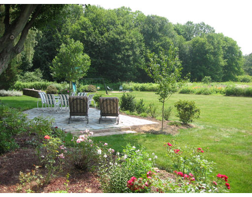 336 Lexington Road Concord, MA 01742 - Photo 8 of 10 a view of backyard with seating area and green space
