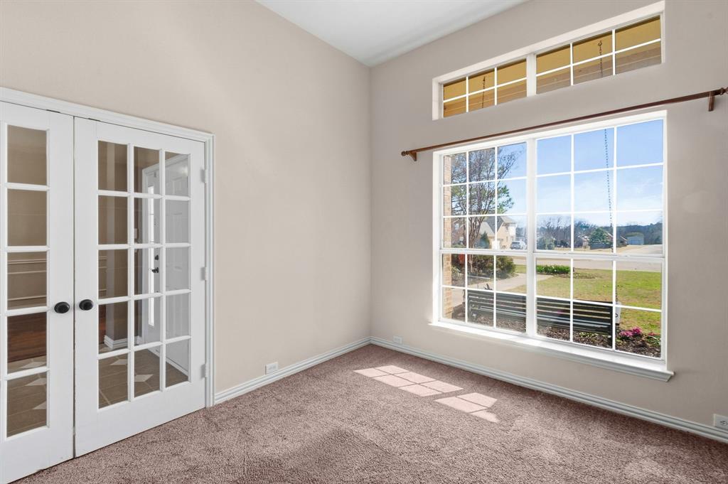 7517 Rodeo Drive Denton, TX 76208 - Photo 11 of 39 This view of the front office shows the closed French doors and your view to the outside.