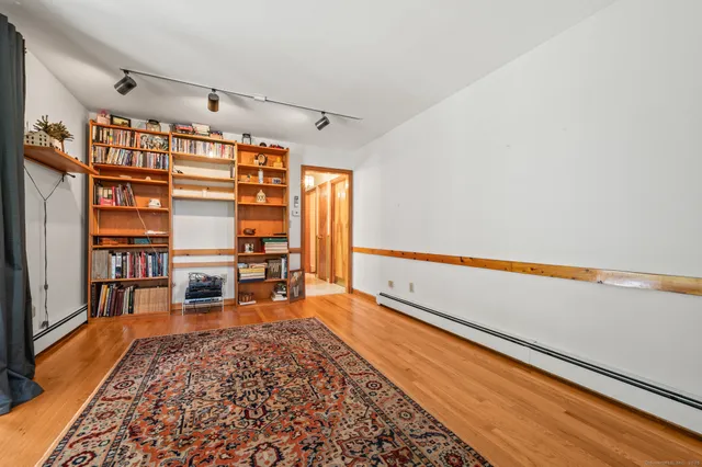 a living room with furniture and a rug