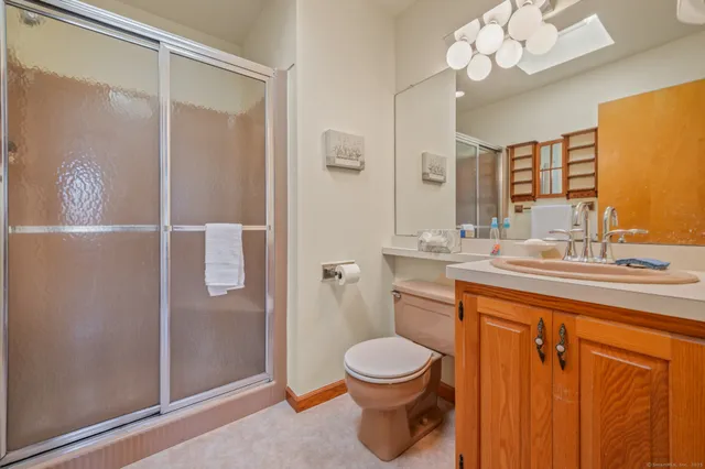 a living room with furniture and a gym equipment