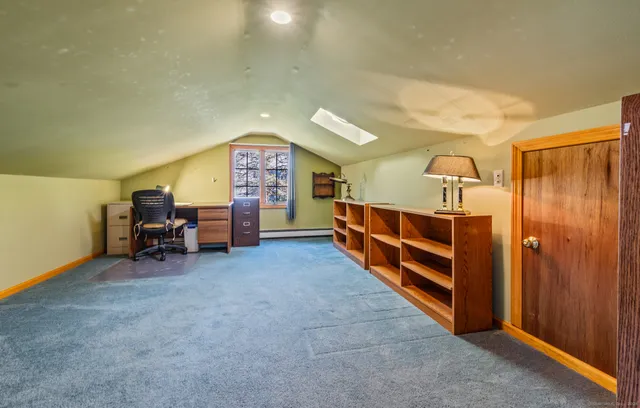 a bed room with furniture and a window