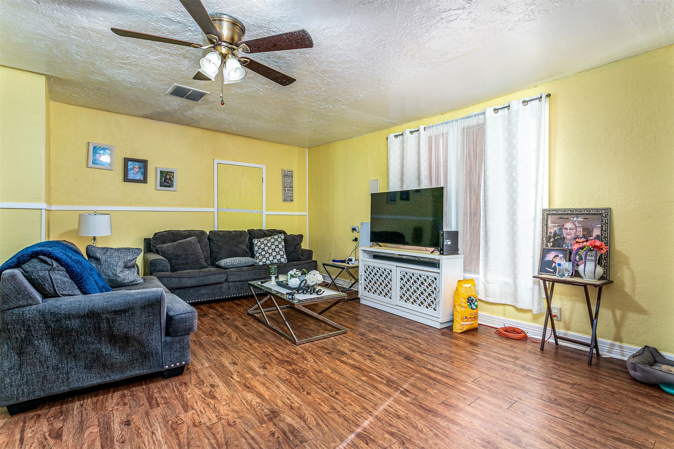 701 Ward Road Baytown, TX 77520 - Photo 4 of 19 a living room with furniture and a flat screen tv