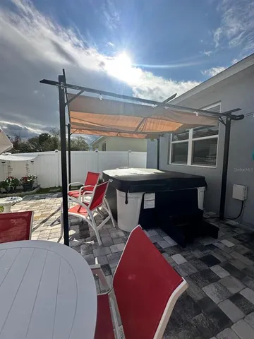 a living room with furniture a rug and a fireplace