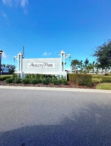 a sign board on the side of a street