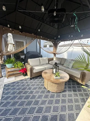 a view of a chairs and tables in the patio