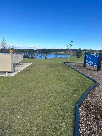 a view of a lake with a big yard