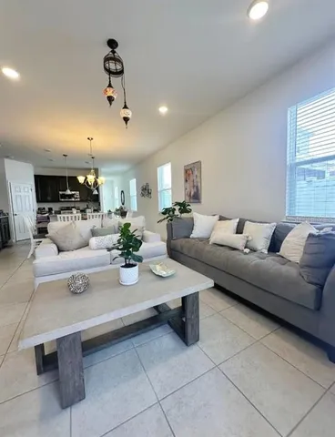 a living room with furniture and a table