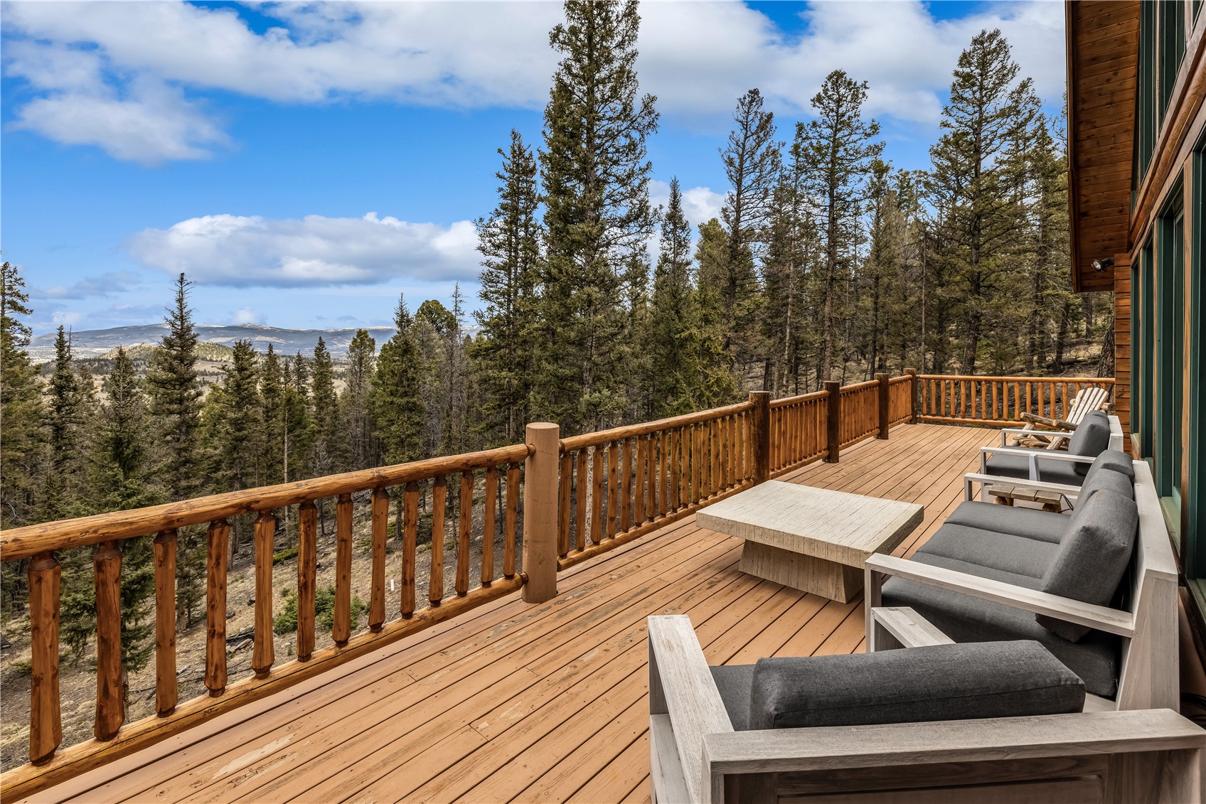 999 Bowstring Como, CO 80456 - Photo 6 of 37 a view of a balcony with wooden floor and outdoor seating