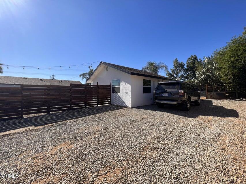 a view of house with a yard
