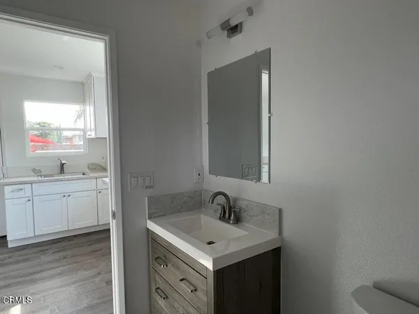 a bathroom with a sink and a mirror