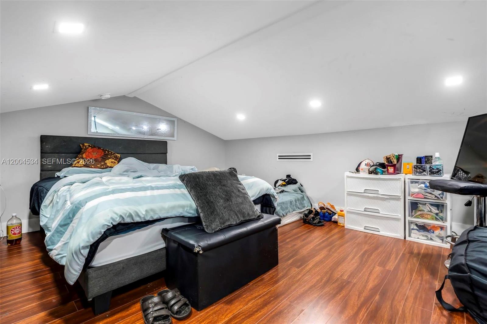 1741 Northwest 44th Street Miami, FL 33142 - Photo 17 of 45 a bed room with furniture and a wooden floor