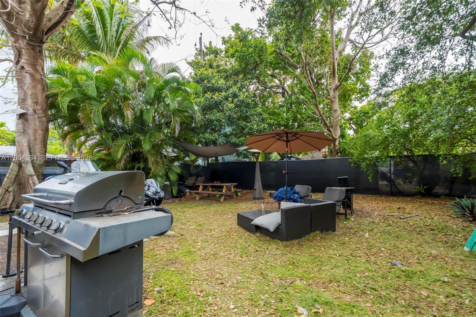 1741 Northwest 44th Street Miami, FL 33142 - Photo 31 of 45 a view of backyard with swimming pool and outdoor seating