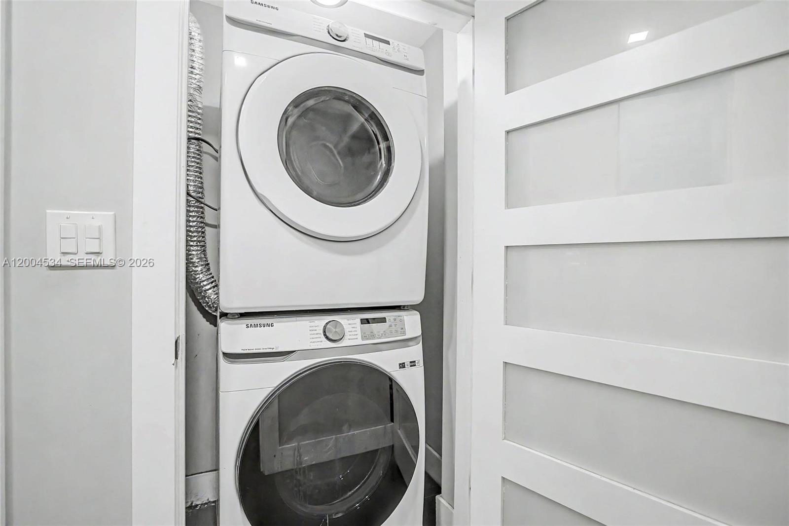 1741 Northwest 44th Street Miami, FL 33142 - Photo 33 of 45 a utility room with dryer and washer