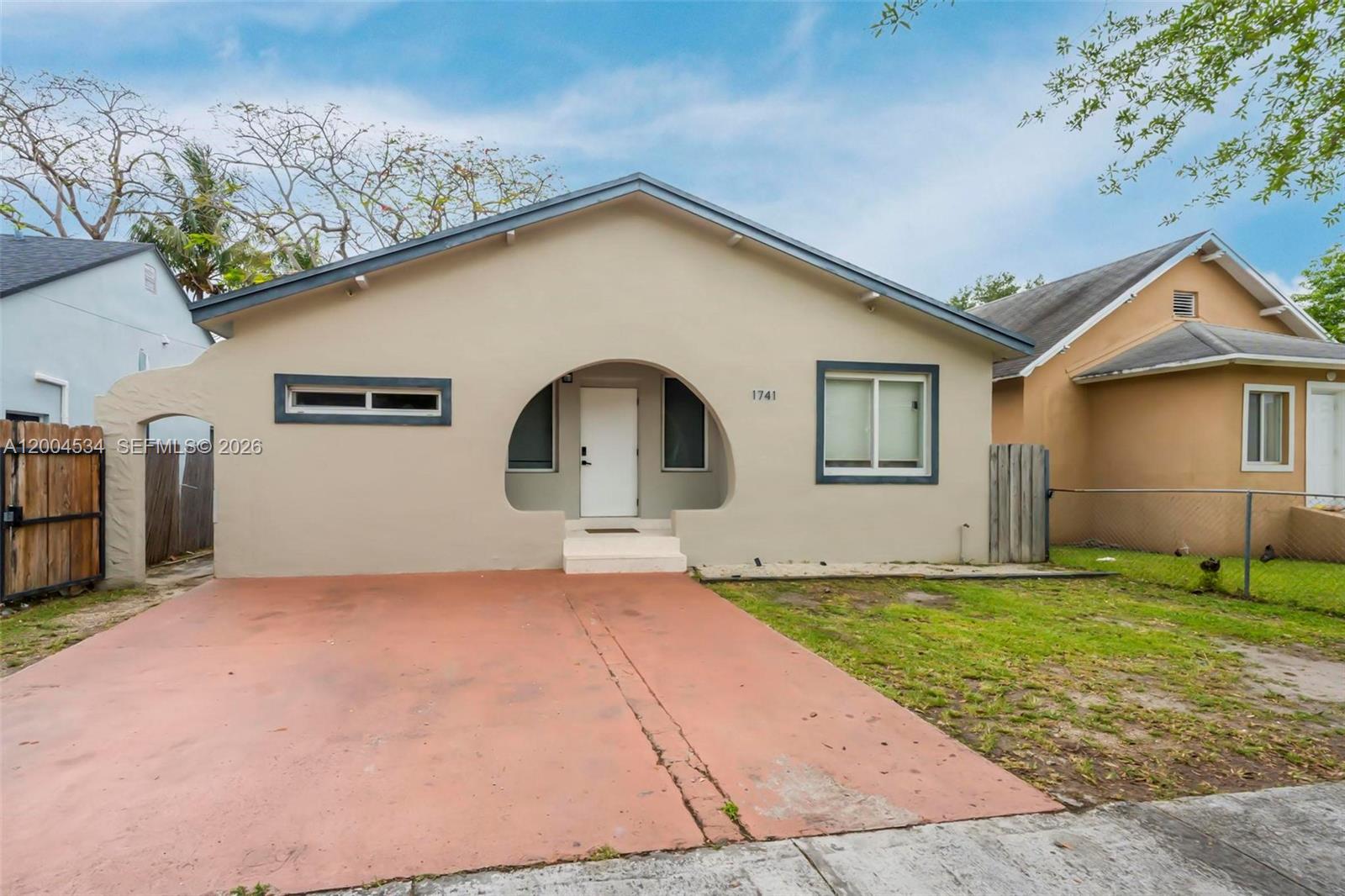 1741 Northwest 44th Street Miami, FL 33142 - Photo 38 of 45 a view of a house with a yard