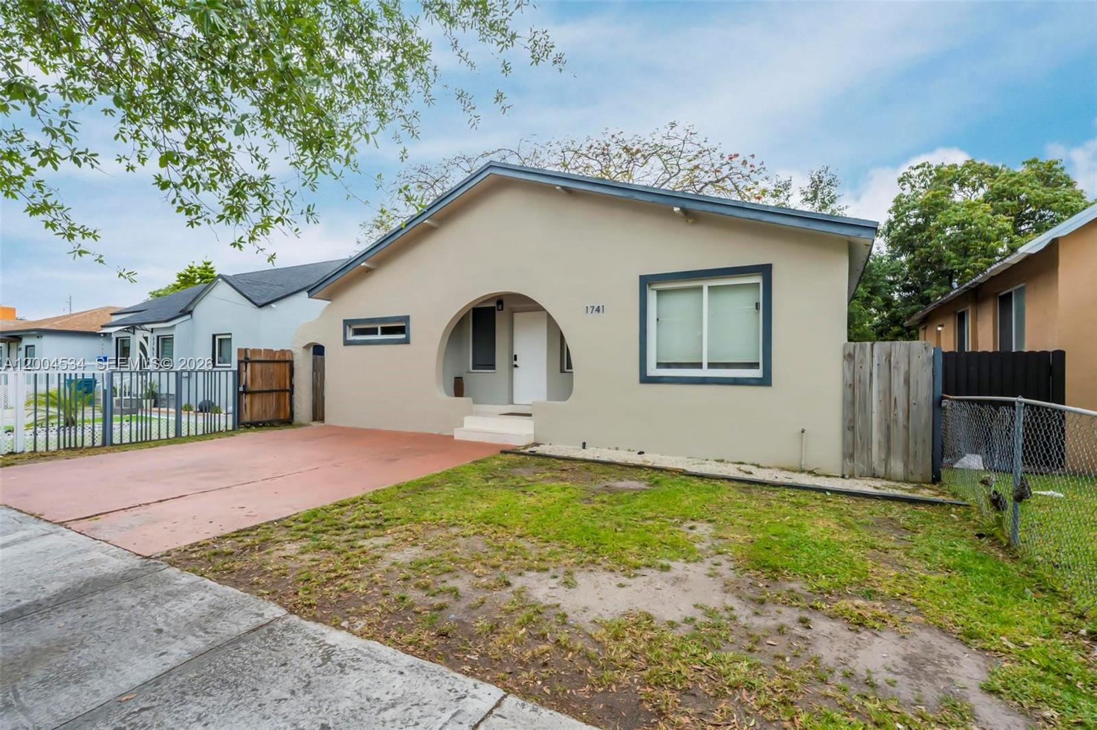 1741 Northwest 44th Street Miami, FL 33142 - Photo 39 of 45 a front view of a house with garden