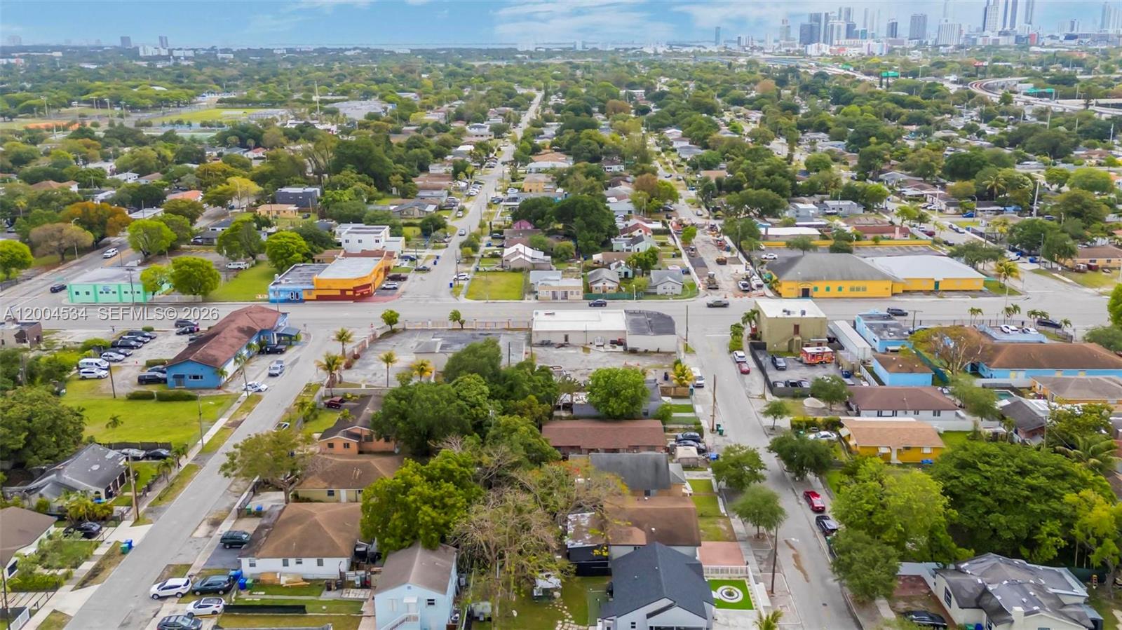 1741 Northwest 44th Street Miami, FL 33142 - Photo 44 of 45 an aerial view of residential houses with outdoor space and swimming pool