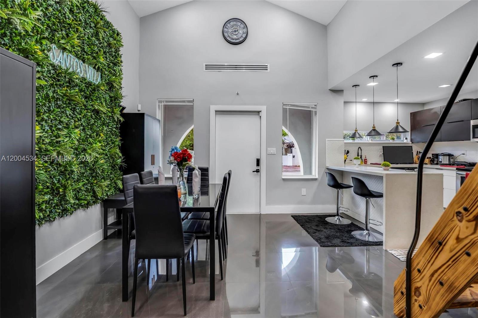 1741 Northwest 44th Street Miami, FL 33142 - Photo 10 of 45 a view of a dining room with furniture and a potted plant