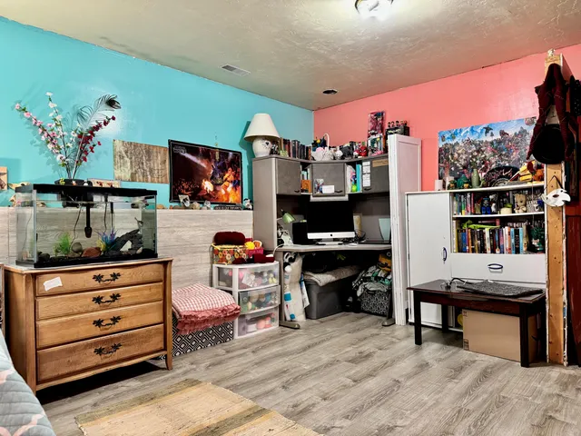 a room with furniture and a flat screen tv