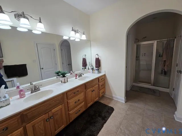 a bathroom with a bathtub sink and a window
