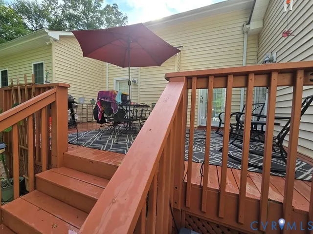 a view of a house with a yard and sitting area