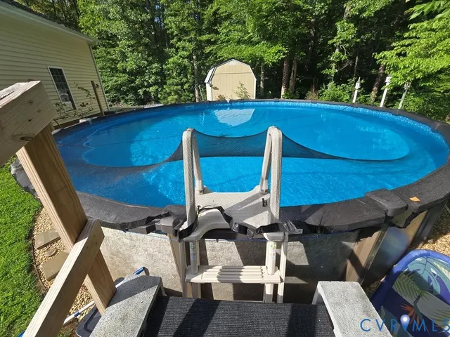 a view of a chair and table in the garden