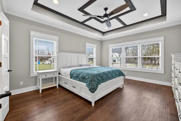 a view of a livingroom with a ceiling fan and window