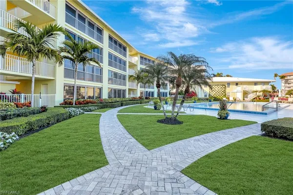 a view of a palm trees in front of a building