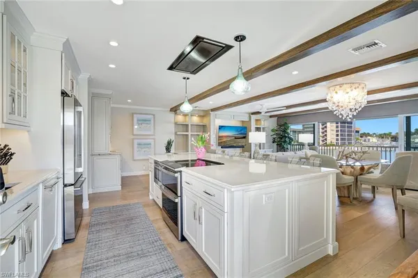 a kitchen with a stove and a wooden floors
