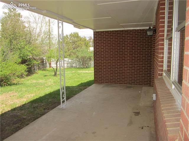 823 Cresta Road Colorado Springs, CO 80905 - Photo 10 of 36 Back patio easily accessed from French Doors in Formal Dining Room.