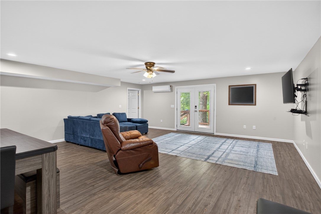 136 Loran Pointe Circle Seneca, SC 29672 - Photo 30 of 50 Hardwood-style flooring extends across this spacious living area, complete with outdoor access.