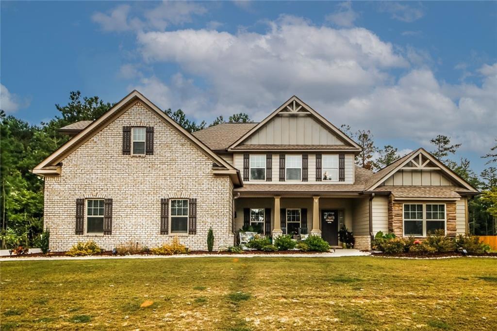 170 Homestead Circle Forsyth, GA 31029 - Photo 1 of 1 a front view of a house with a yard