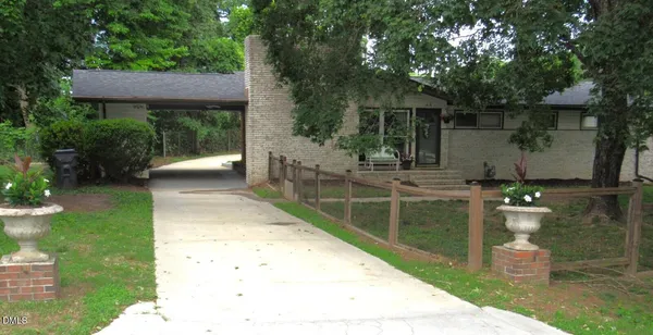a backyard of a house with seating space