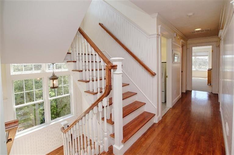163 Jefferson Road Bourne, MA 02532 - Photo 25 of 35 a view of staircase with wooden floor and white walls