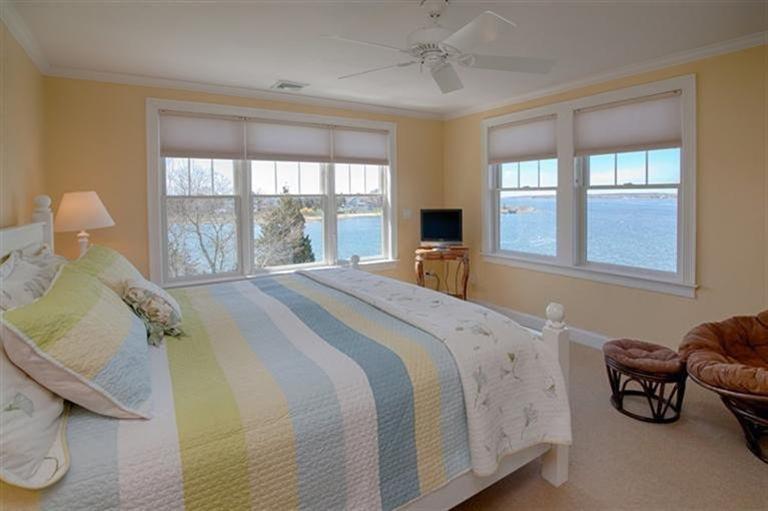 163 Jefferson Road Bourne, MA 02532 - Photo 34 of 35 a spacious bedroom with a bed and a window
